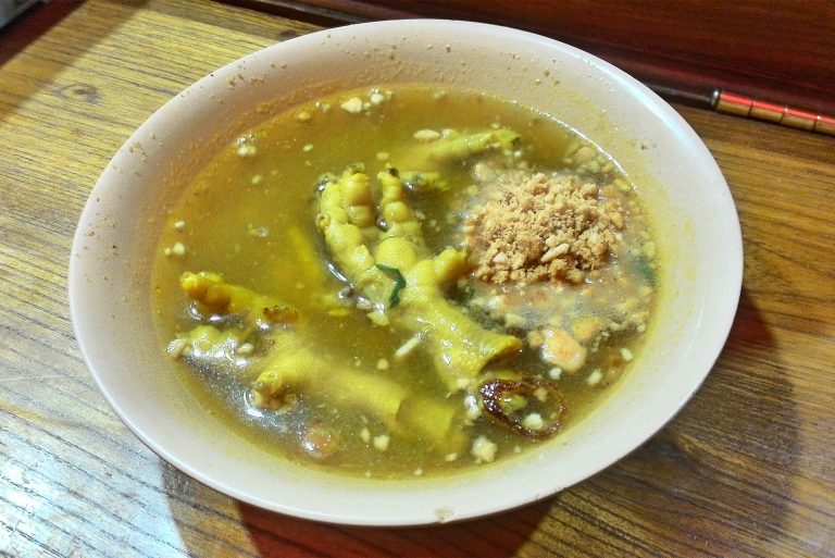 Soto Ceker notably seen with chicken feet in yellowish spicy broth soup, which uses spices including shallot, garlic, lemongrass and turmeric and served with of cabbage, celery, rice noodles, and garnished to taste with sambal, lime and soy. Photo: Gunawan Kartapranata